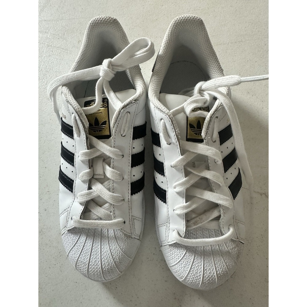 adidas Women’s White and Black Classic Shell-Toe Sneakers